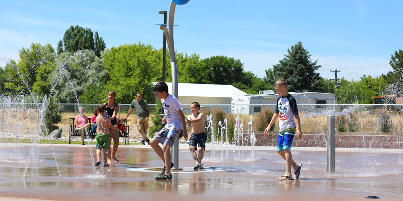 image: kids playing in splash park