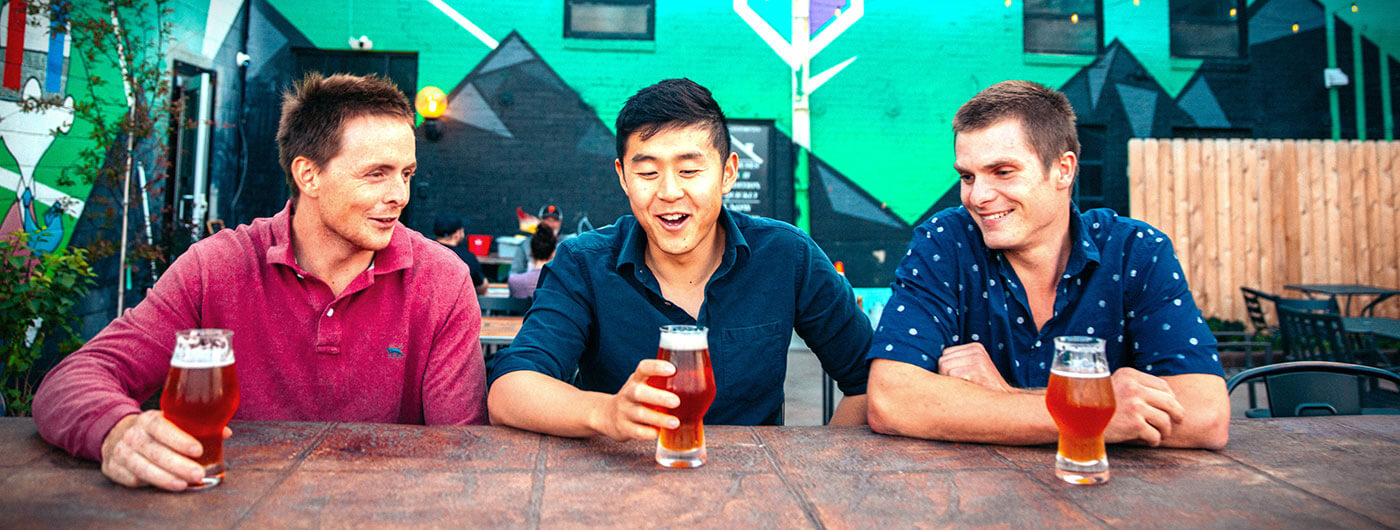 3 guys having beers